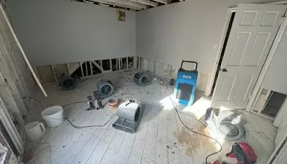 Drying equipment set up and running inside a house during a water damage job